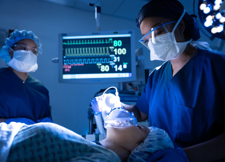 Two CRNAs performing anesthesia