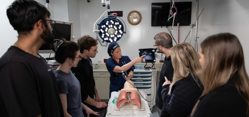 CRNA instructor with group of students
