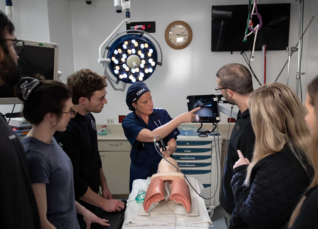 CRNA instructor with group of students