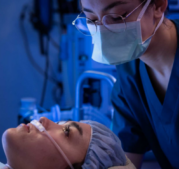 CRNA applying oxygen to female patient