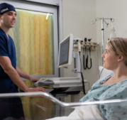 CRNA consulting with a patient