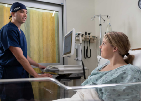 CRNA consulting with a patient