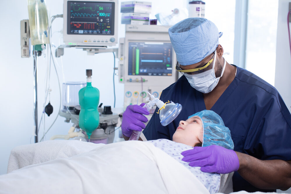 CRNA safely applying anesthesia to child