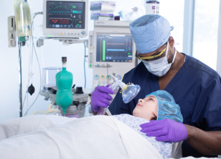 CRNA safely applying anesthesia to child
