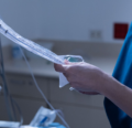 CRNA preparing anesthesia space for surgery.