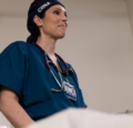 CRNA talking with a patient in bed