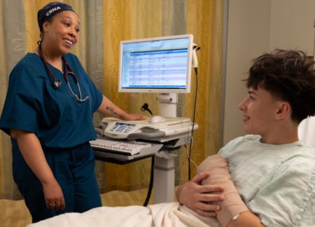CRNA reviewing a checklist with a child