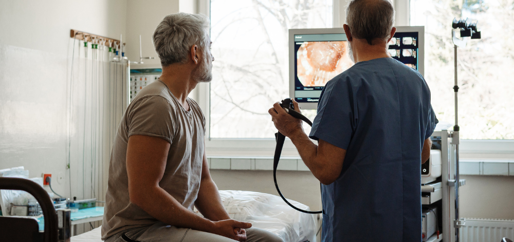 Patient with doctor going through colonoscopy results