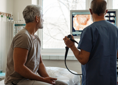 Patient with doctor going through colonoscopy results