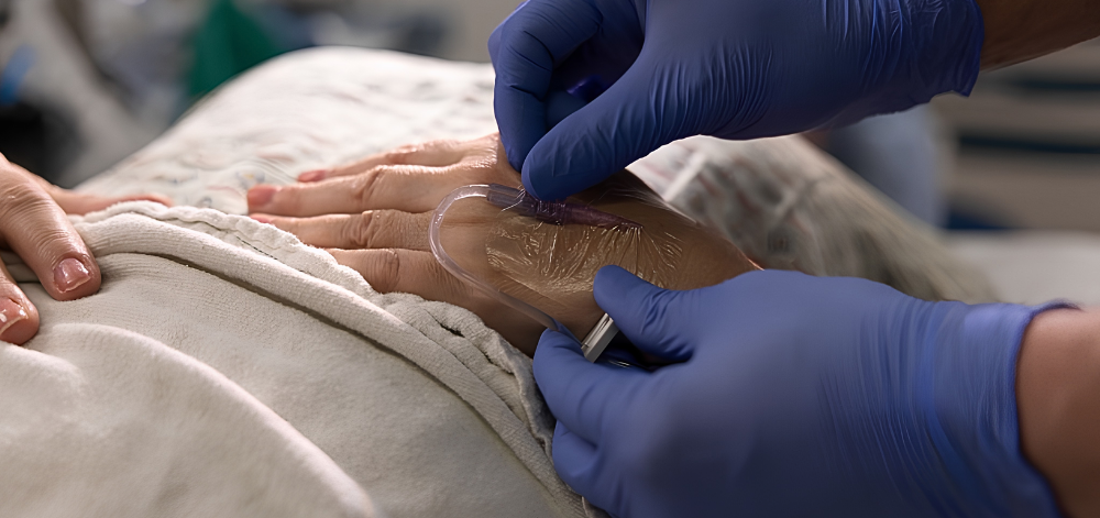 Close up of hands adjusting IV