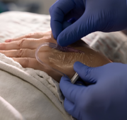 Close up of hands adjusting IV