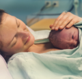 Woman with newborn on chest