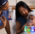 CRNA speaking to woman and her child before surgery