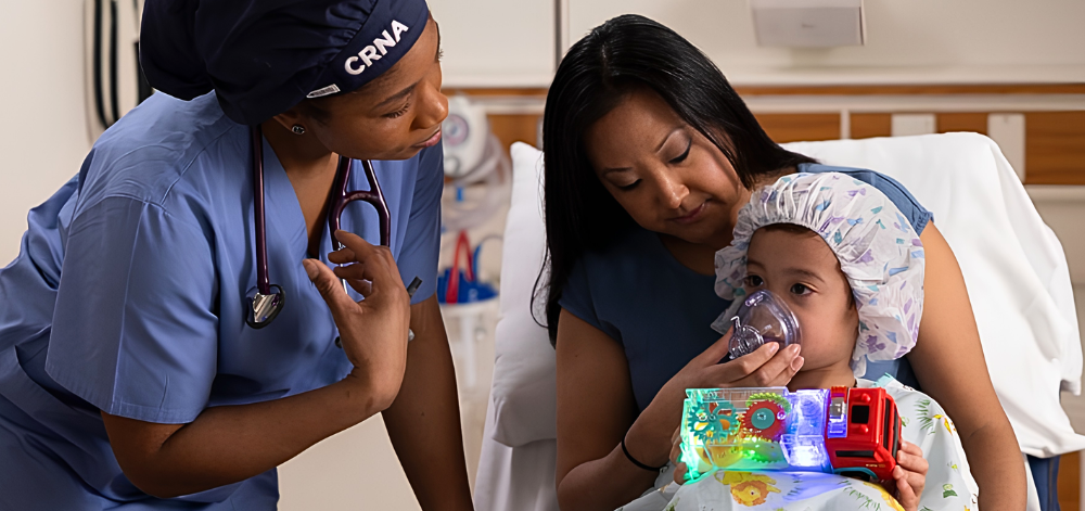 CRNA speaking to woman and her child before surgery