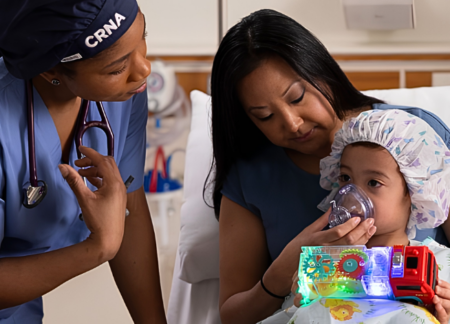 CRNA speaking to woman and her child before surgery