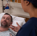 CRNA speaking to man at bedside