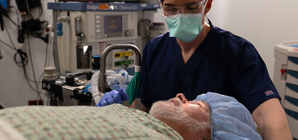 Older man on OR table with CRNA