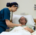 1 CRNA checking on patient post surgery