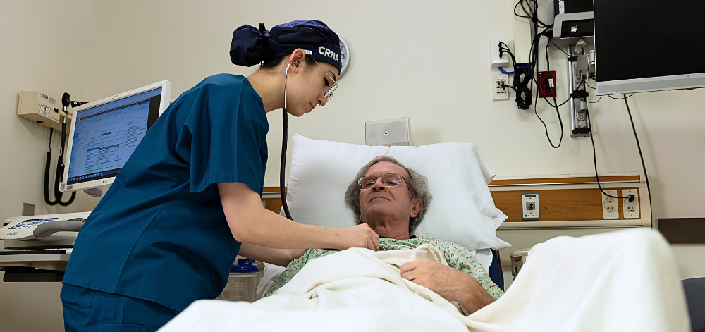 1 CRNA checking on patient post surgery