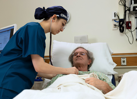 1 CRNA checking on patient post surgery