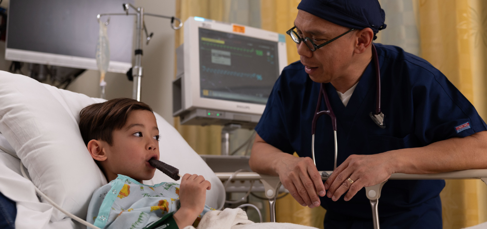 Child patient eating a popsicle