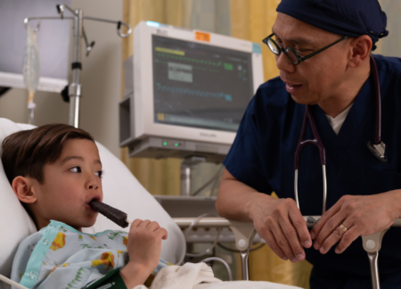 Child patient eating a popsicle