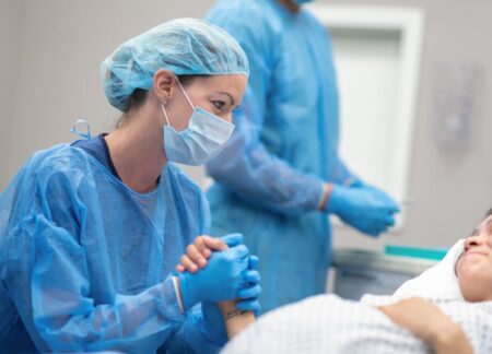 CRNA providing care to a patient during surgery